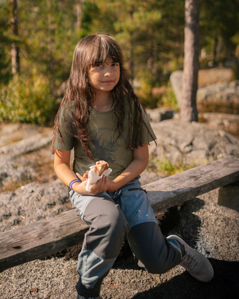 Pinewood childrens model on a blurred natural background