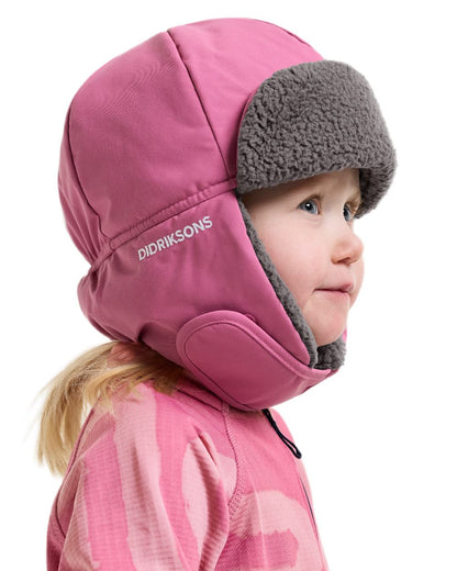Heather Pink coloured Didriksons Biggles Cap 7 on white background 