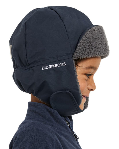 Navy coloured Didriksons Biggles Cap 7 on white background 