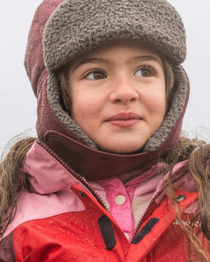 Anemon Red Coloured Didriksons Biggles Kids Cap on outdoor background 