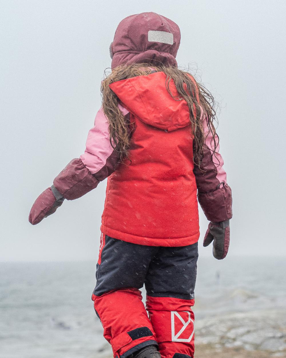 Anemon Red Coloured Didriksons Biggles Kids Cap on outdoor background 
