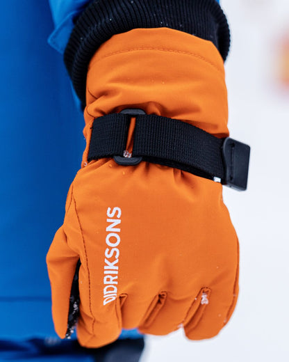 Orange Jam coloured Didriksons Childrens Biggles Gloves on snow background 