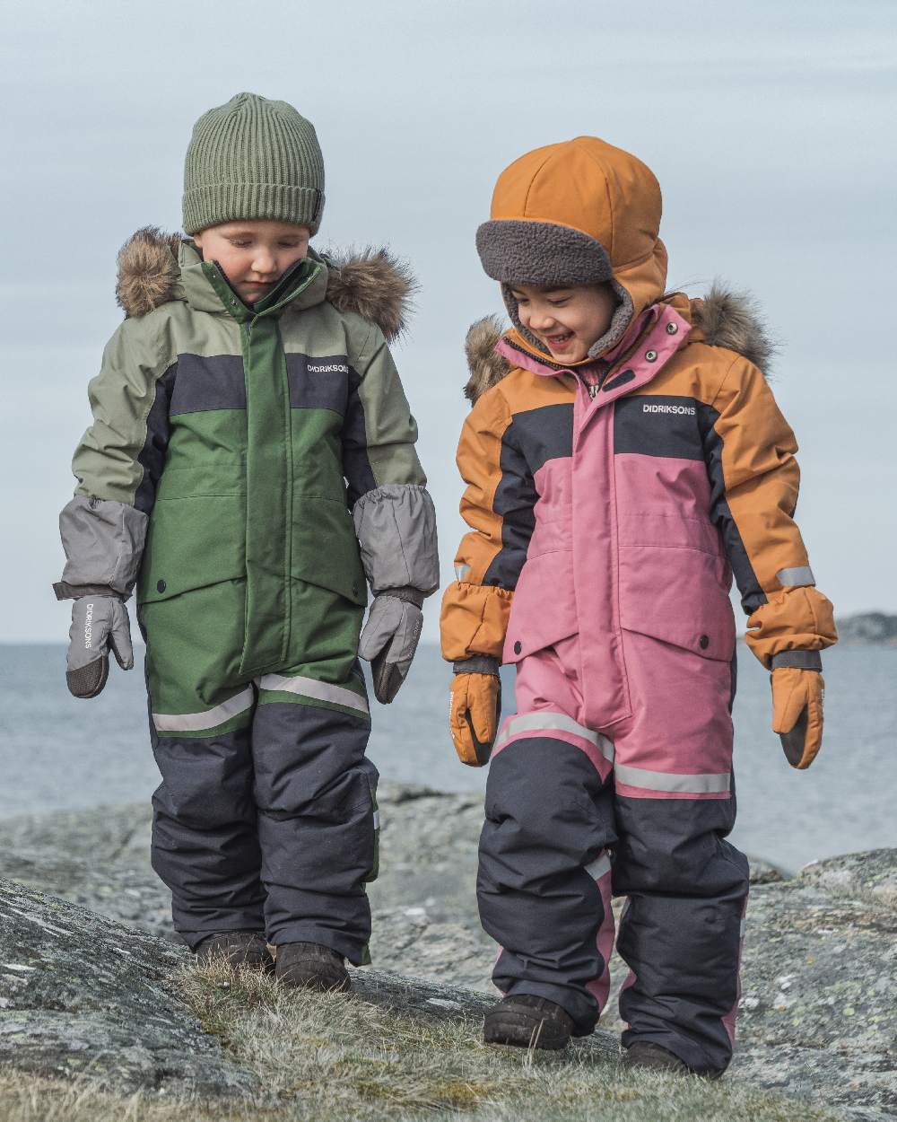 Heather Pink Coloured Didriksons Childrens Bjärven Coveralls on outdoor background 