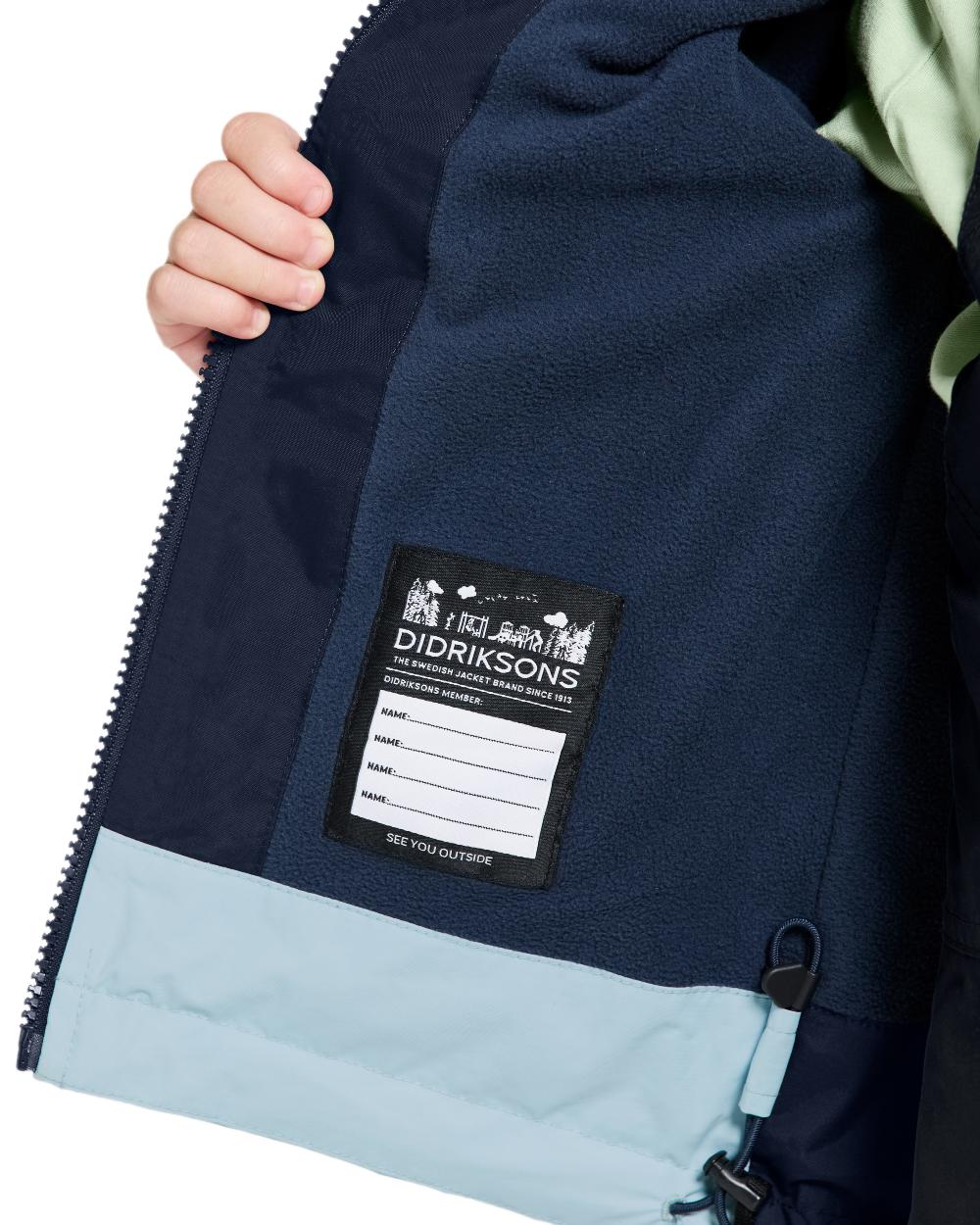 Navy coloured Didriksons Childrens Bladet Jacket on white background 