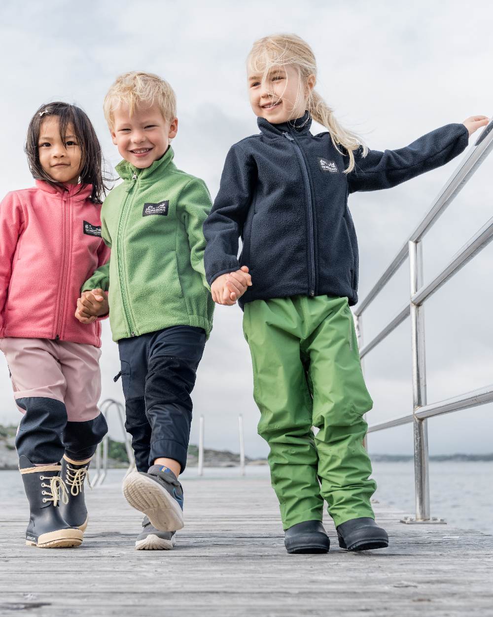 Dark Night Blue coloured Didriksons Childrens Muskot Jacket on sky background 
