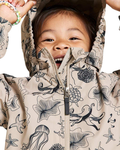 Ocean Beach Beige coloured Didriksons Childrens Norma Printed Jacket on white background 