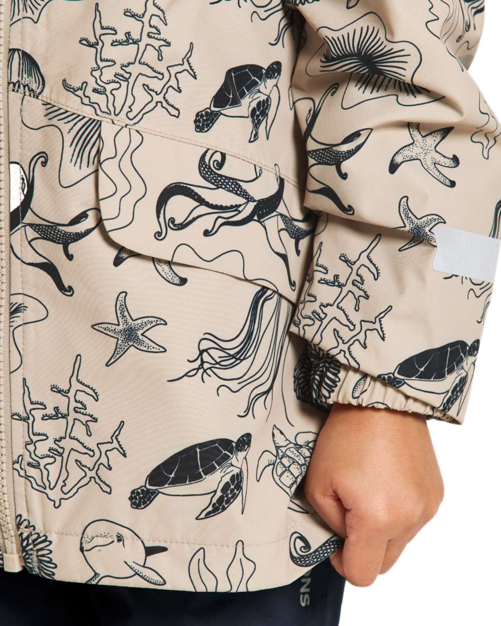Ocean Beach Beige coloured Didriksons Childrens Norma Printed Jacket on white background 