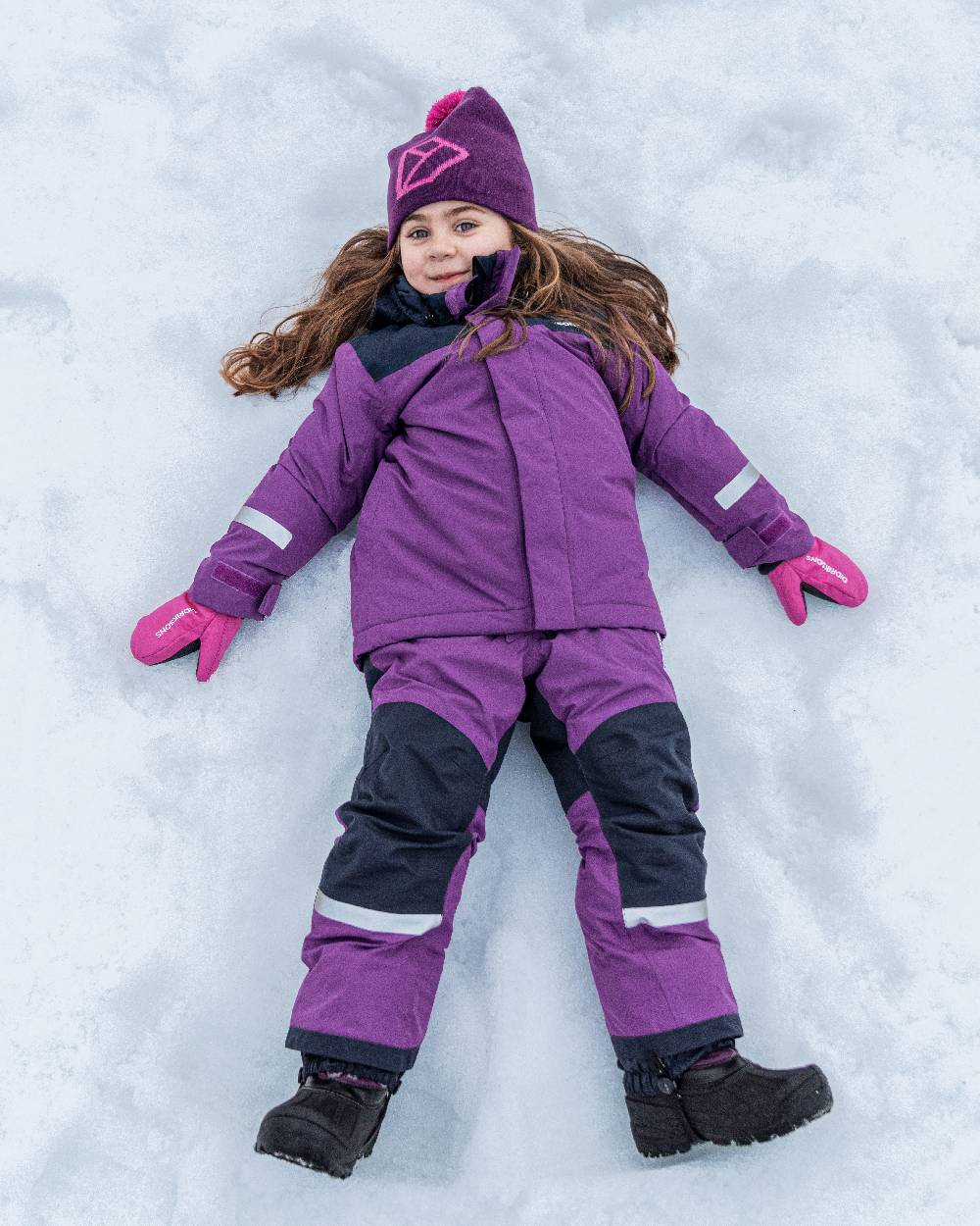 Royal Purple Coloured Didriksons Kids Skare Set on snow background 