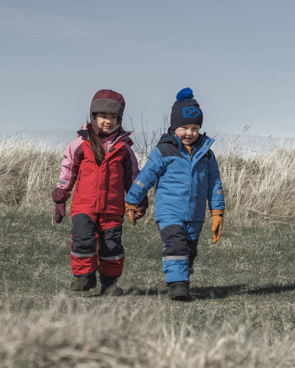 Sapphire Blue Coloured Didriksons Kids Skare Set on mountain background 