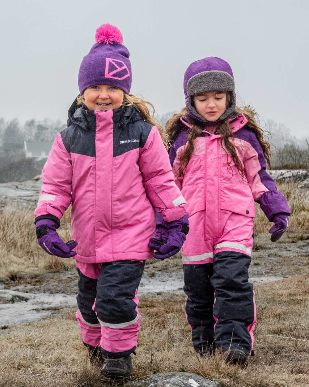 Sweet Pink Coloured Didriksons Kids Skare Set on mountain background 
