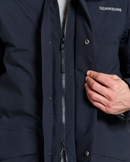 Dark Night Blue coloured Didriksons Mens Akilles Parka II on white background 