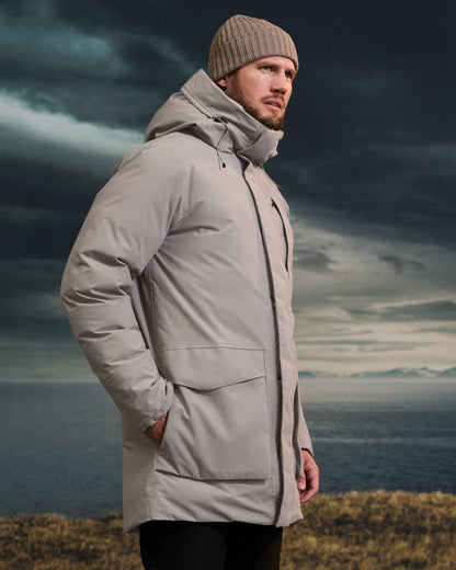 Ash Brown coloured Didriksons Mens Akilles Parka II on sea background 