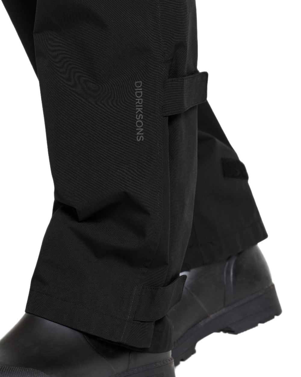 Black coloured Didriksons Mens Grit Rain Pants on white background 