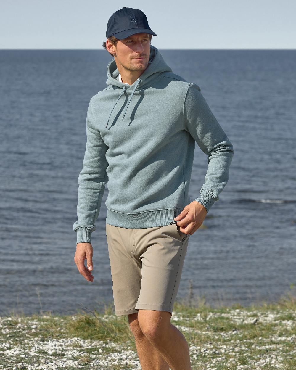 Ash Brown coloured Didriksons Mens Ian Shorts on sea background 