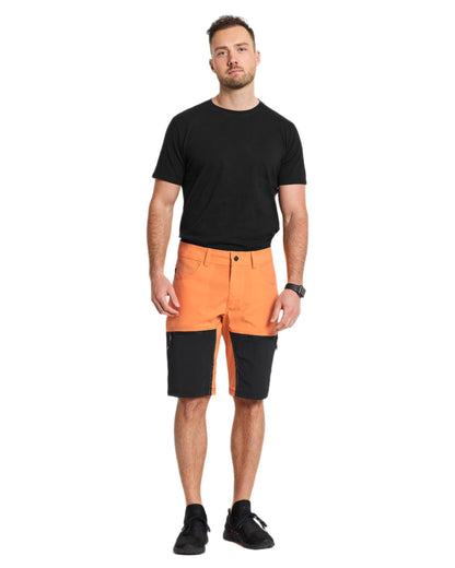 Sunset coloured Didriksons Mens Kallax Shorts on white background 