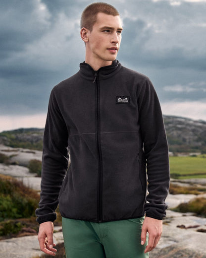 Graphite coloured Didriksons Mens Vito Full Zip Fleece on mountain background 