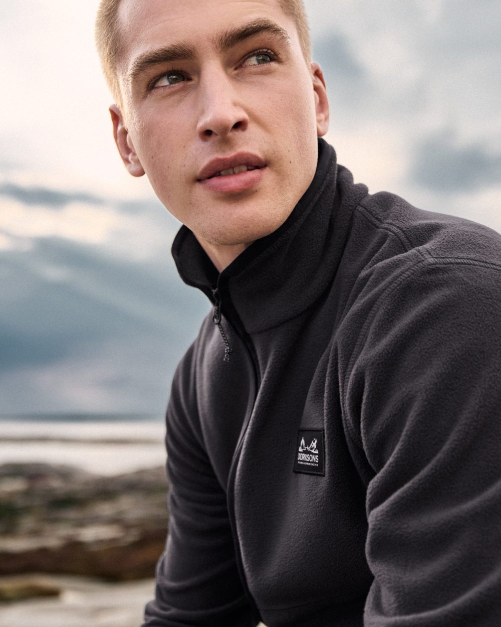 Graphite coloured Didriksons Mens Vito Full Zip Fleece on sky background 