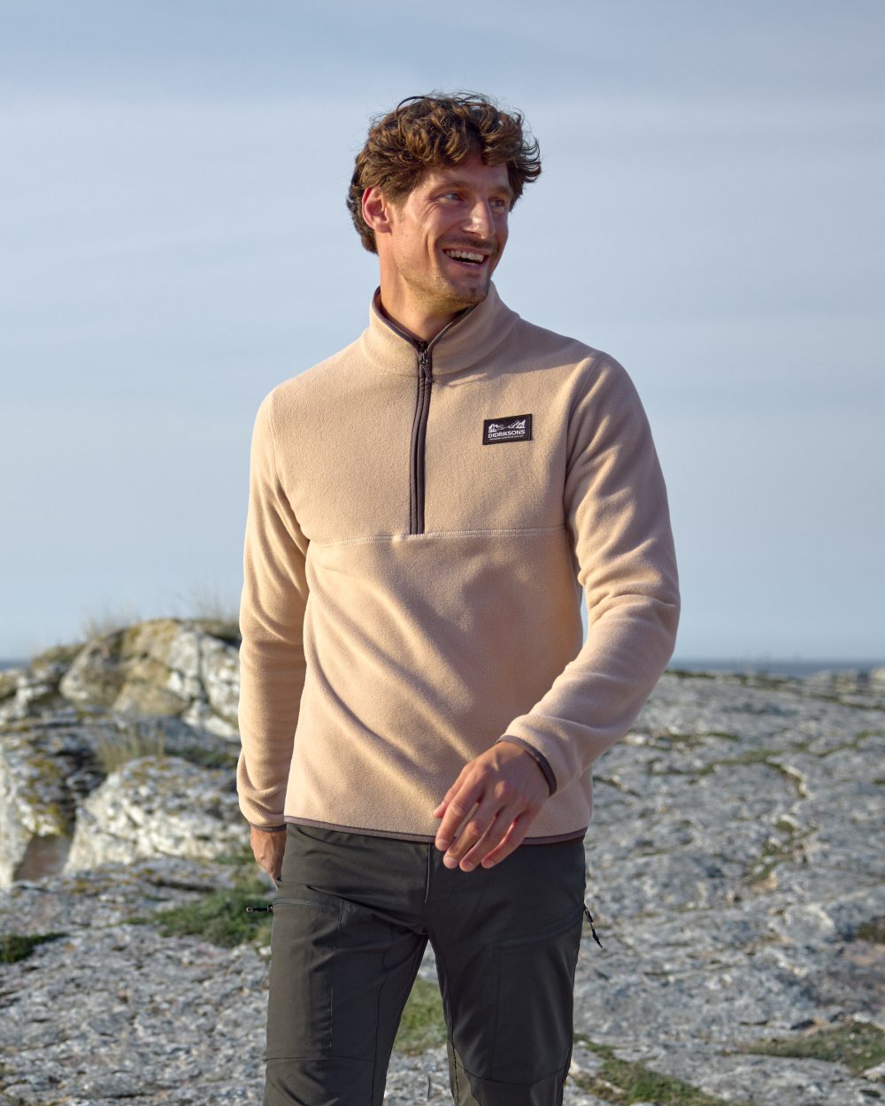 Beach Biege coloured Didriksons Mens Vito USX Half Zip Sweater on coastal background 