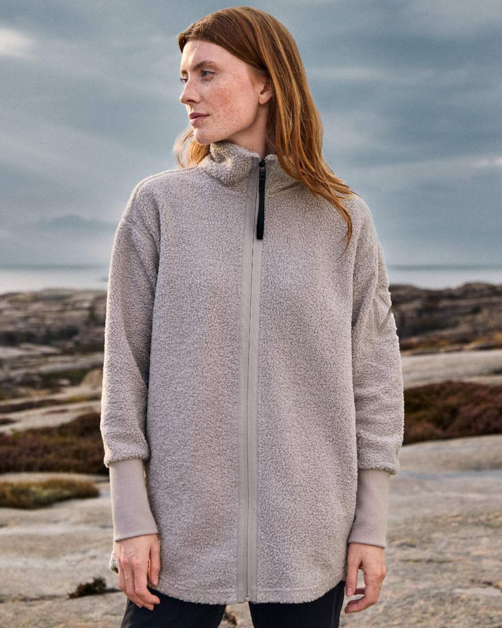 Sunrise Mist coloured Didriksons Sally Full Zip Fleece Jacket 2 on sea background 