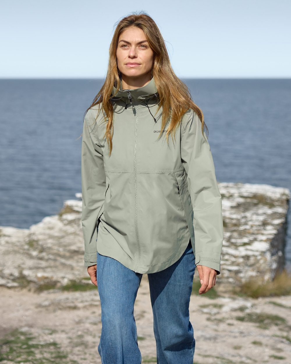 Wilted Leaf coloured Didriksons Tilde Womens Jacket on coastal background 