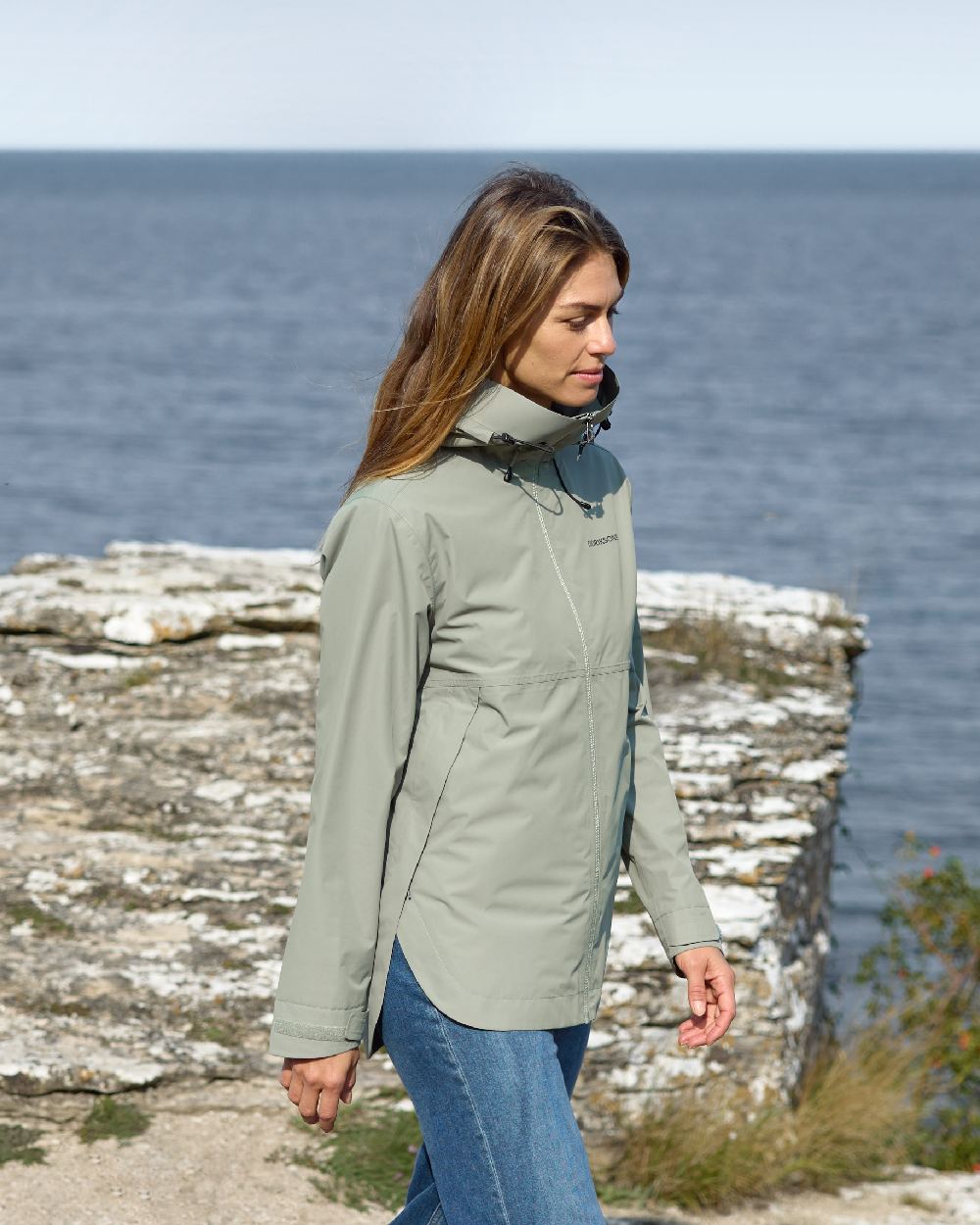 Wilted Leaf coloured Didriksons Tilde Womens Jacket on coastal background 