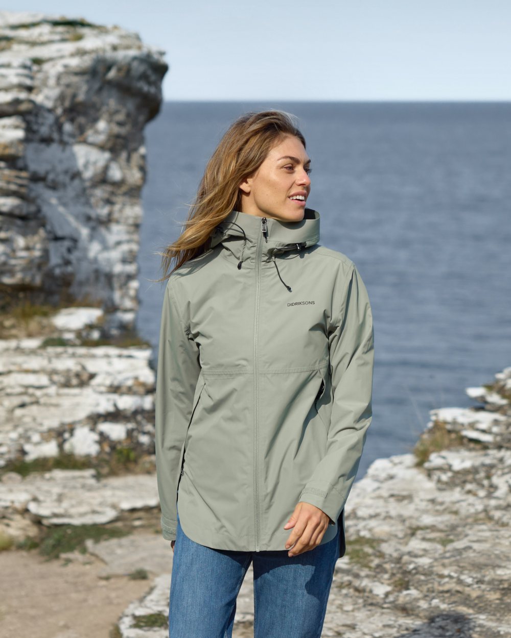 Wilted Leaf coloured Didriksons Tilde Womens Jacket on coastal background 