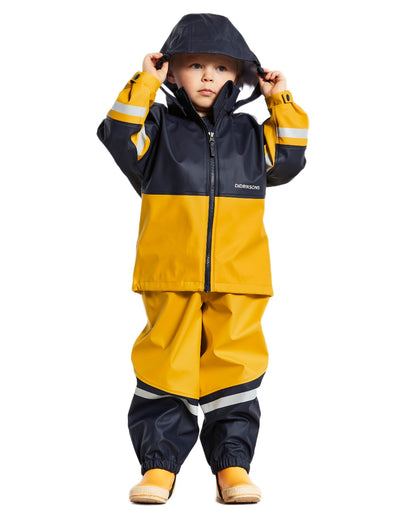 Oat Yellow coloured Didriksons Waterman Kids Rain Set on white background 