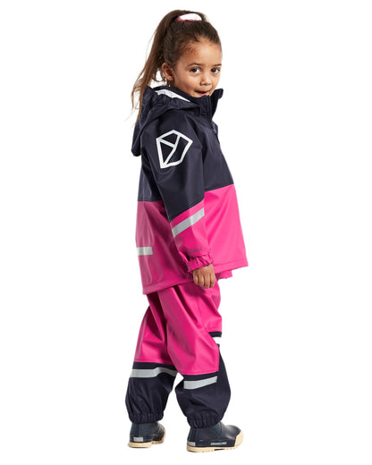 Plastic Pink coloured Didriksons Waterman Kids Rain Set on white background 