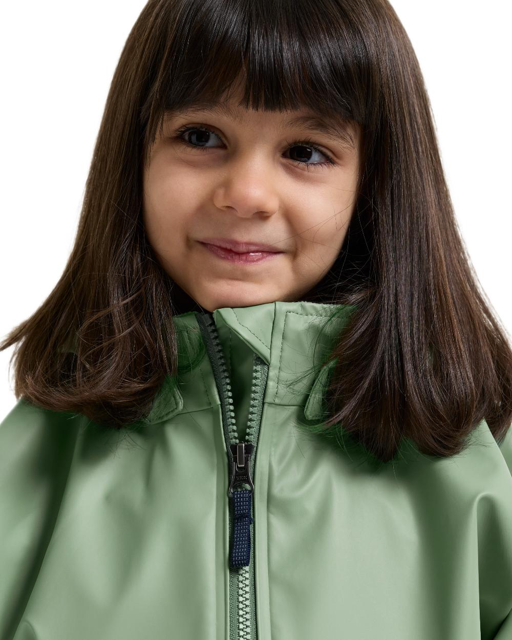 Sage Green coloured Didriksons Waterman Kids Rain Set on white background 