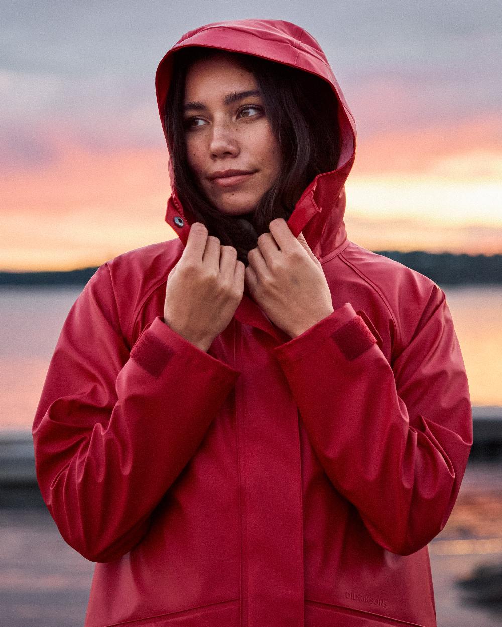 Spring Red Coloured Didriksons Womens Elly Galon Parka on outdoor background 