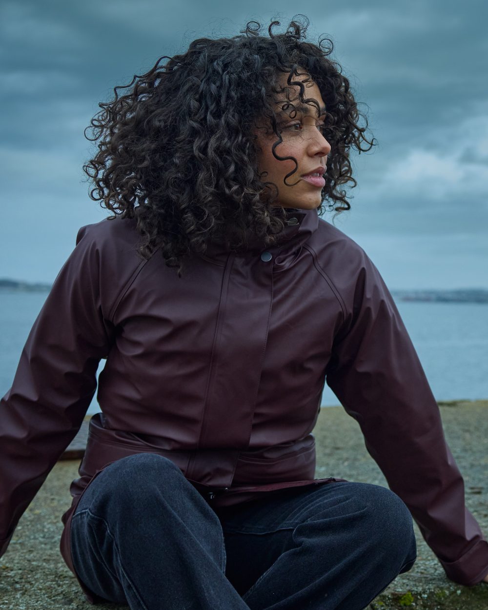 Old Rust coloured Didriksons Womens Elly Parka 4 on sea background 