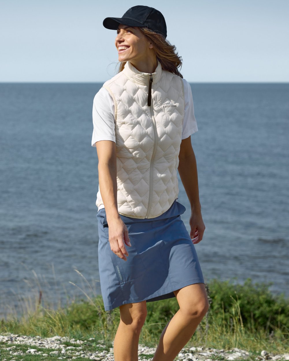 White Foam coloured Didriksons Womens Evy Vest on sea background 