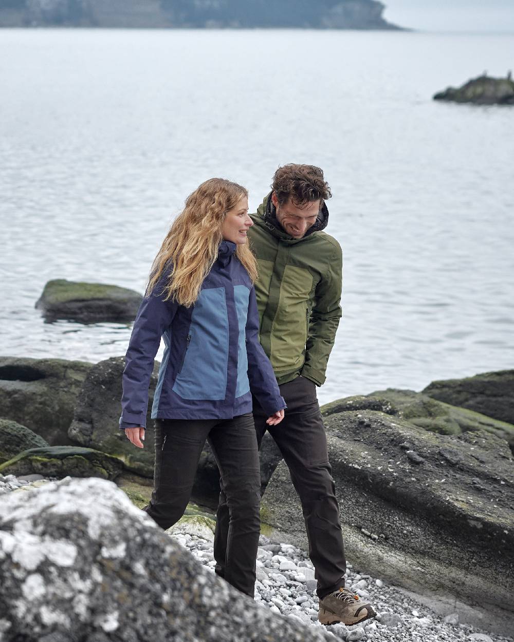 Blue Arcad coloured Didriksons Womens Grit Jacket 3 on sea background 