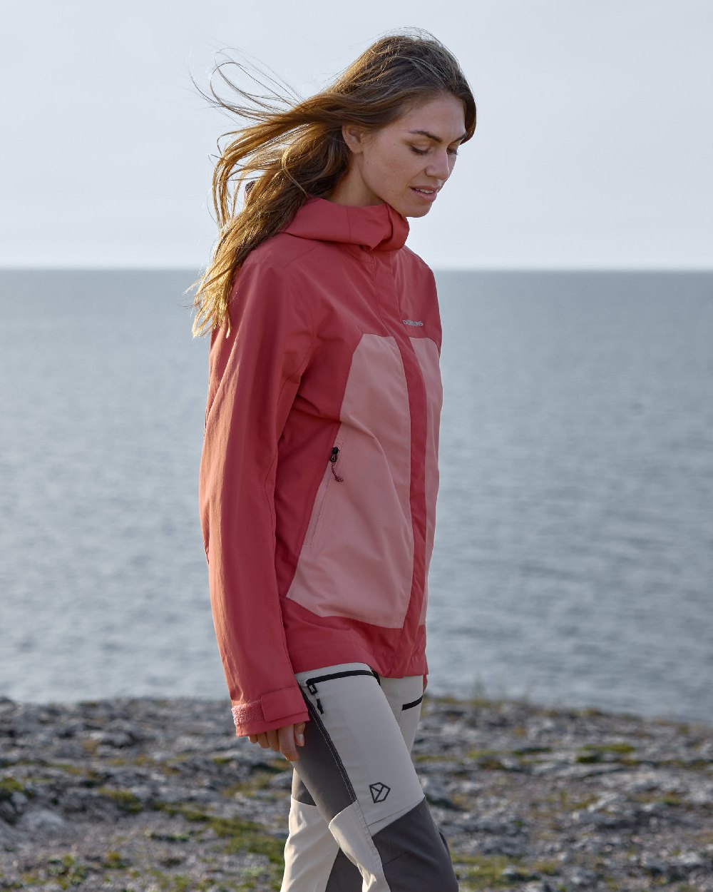 Pink Blush coloured Didriksons Womens Grit Jacket 3 on sea background 