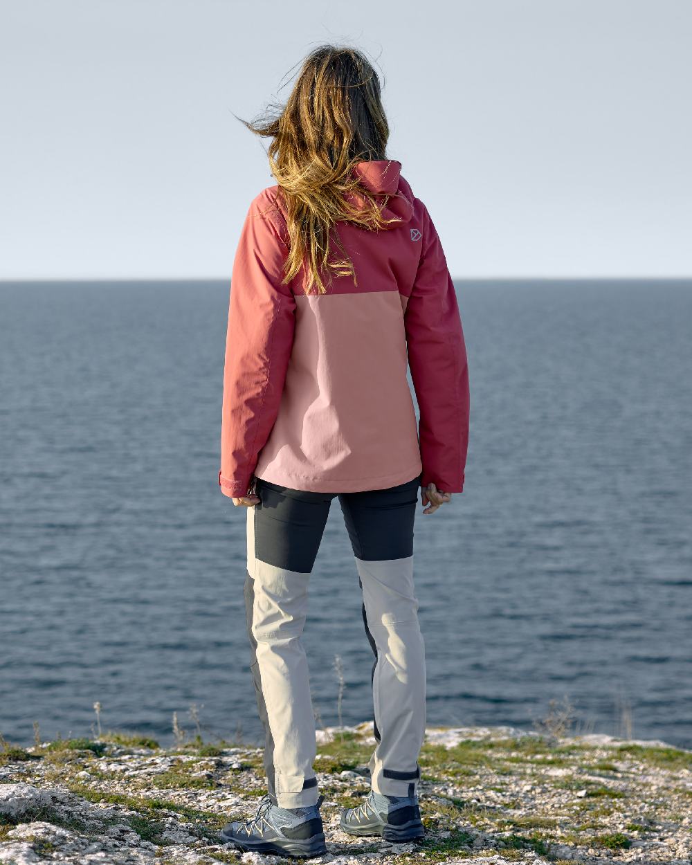 Pink Blush coloured Didriksons Womens Grit Jacket 3 on sea background 