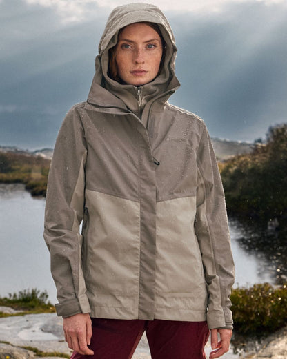Beach Beige coloured Didriksons Womens Grit Jacket 4 on sea background 