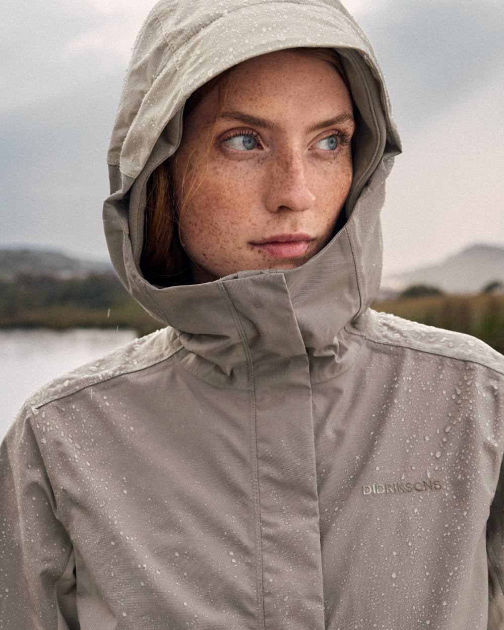 Beach Beige coloured Didriksons Womens Grit Jacket 4 on sea background 
