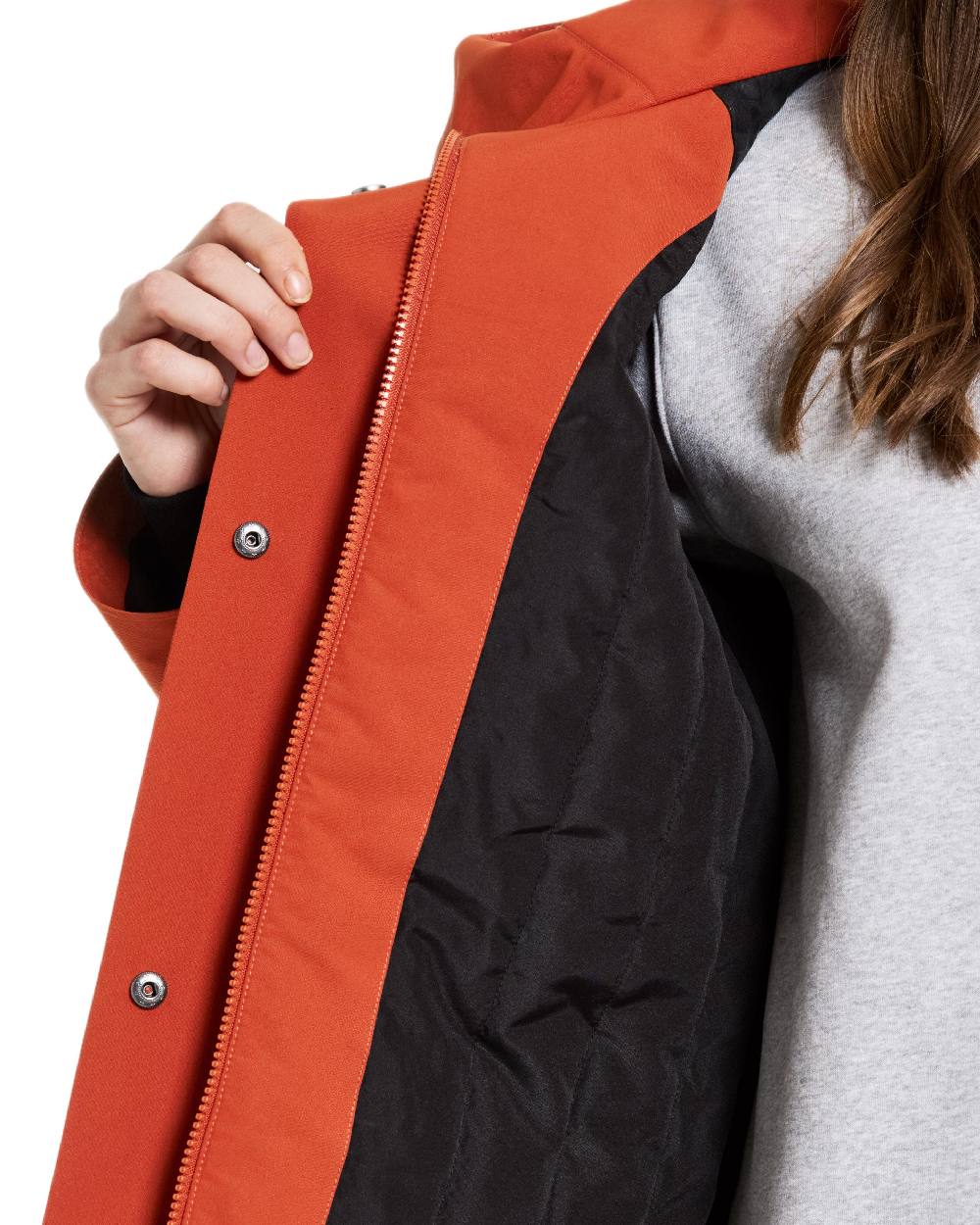 Rust Coloured Didriksons Womens Harriet Parka on white background 