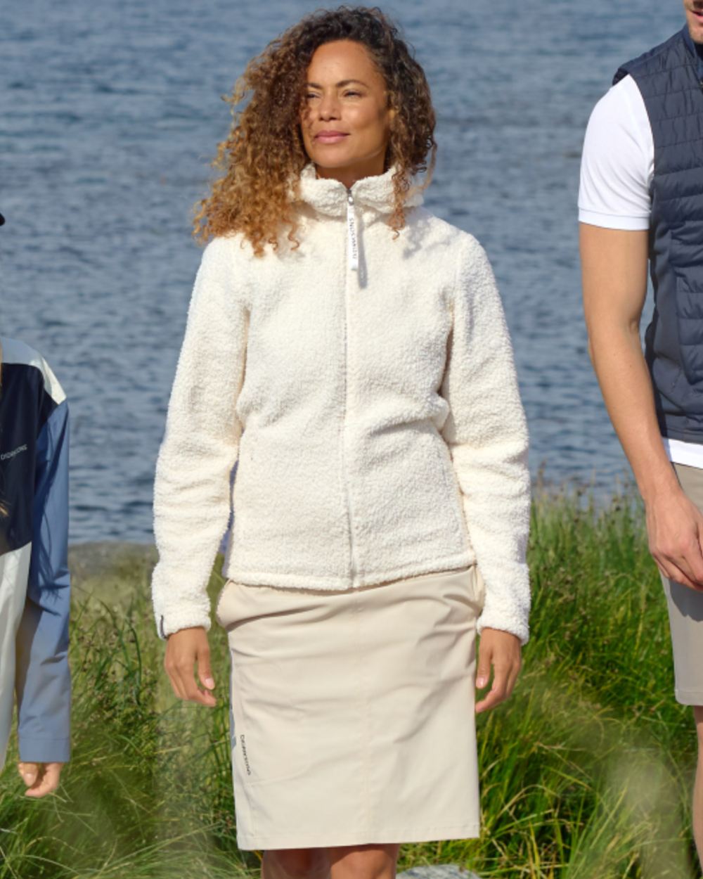 Light Beige coloured Didriksons Womens Liv Skirt on sea background 