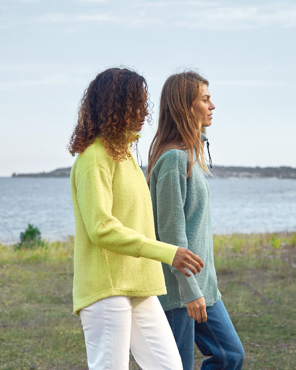 Light Avocado coloured Didriksons Womens Monia Half Zip Sweater on coastal background 