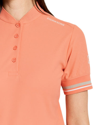 Clay Pink coloured Didriksons Womens Patty Polo T-Shirt on white background 
