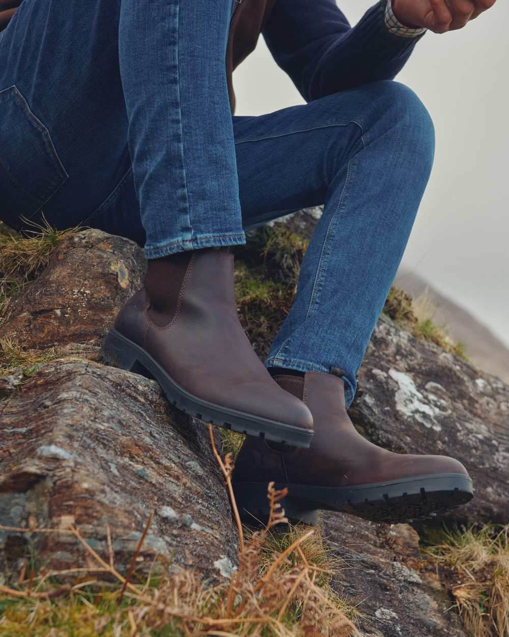 Mahogany coloured Dubarry Antrim Country Boots on rock background 