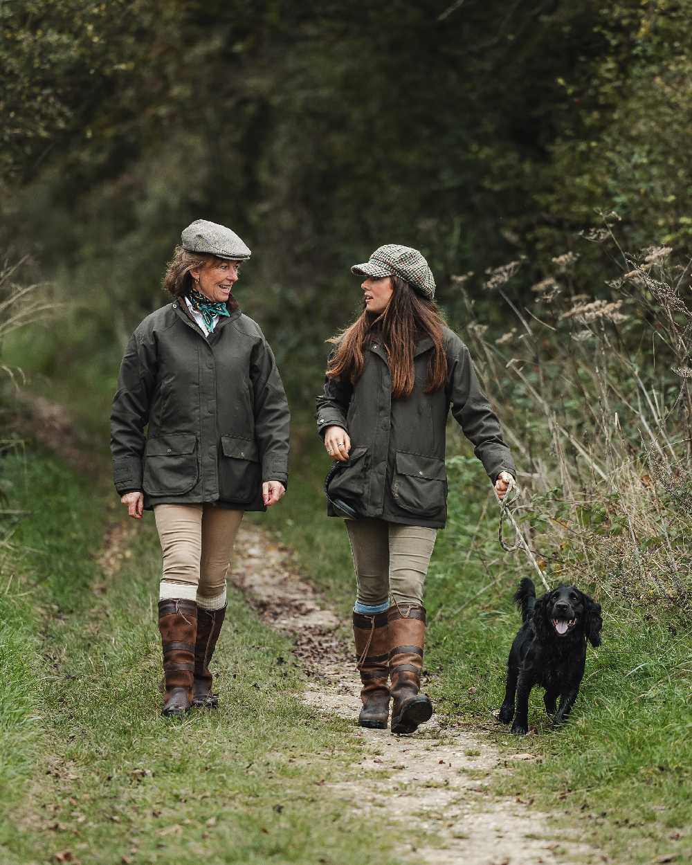 Ivy Coloured Dubarry Castlehyde All-Purpose Shooting Coat on forest background 