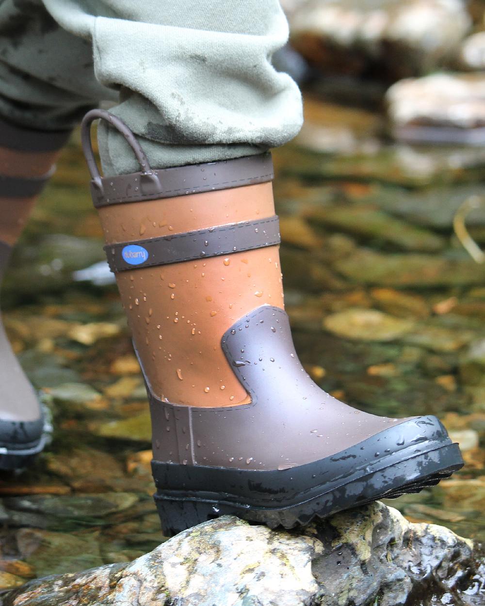 Walnut Coloured Dubarry Childrens Splash Waterproof Boots on outdoor background 