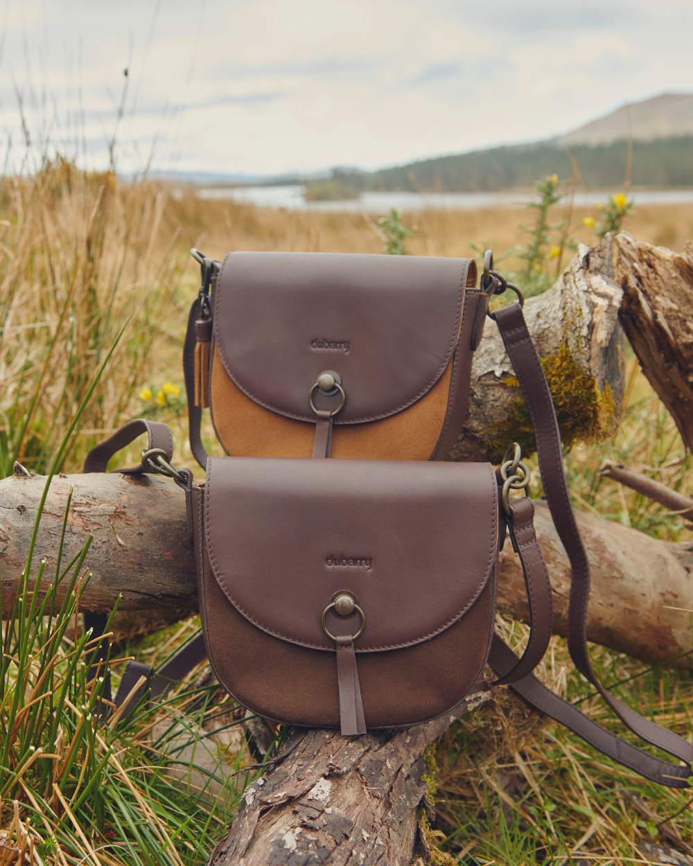 Camel coloured Dubarry Crossgar Saddle Bag on grassy background 