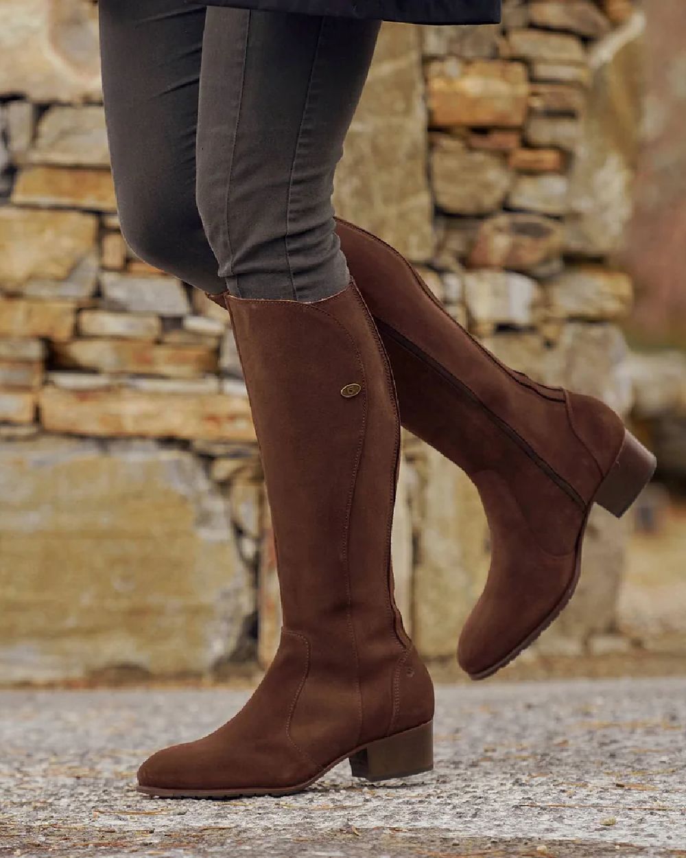 Cigar coloured Dubarry Downpatrick Knee High Boots on road background 