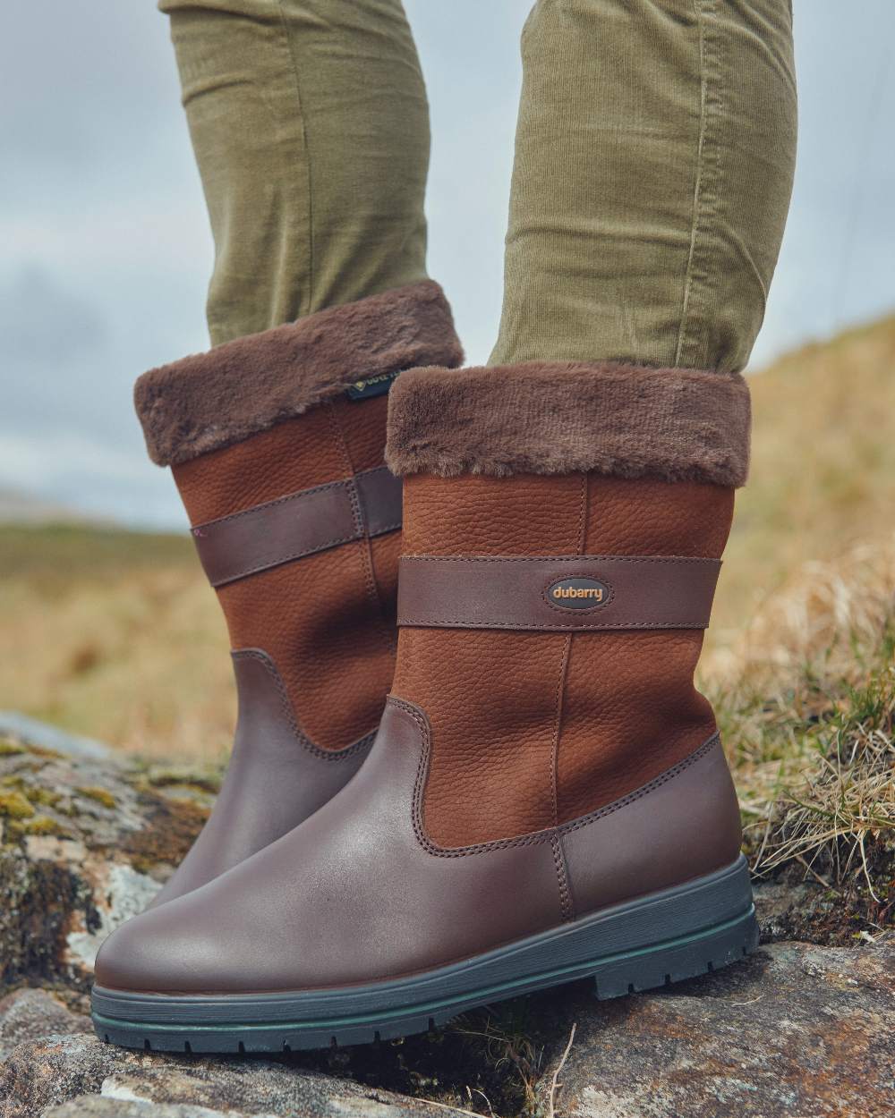 Walnut coloured Dubarry Foxrock Country Boot on grass background 