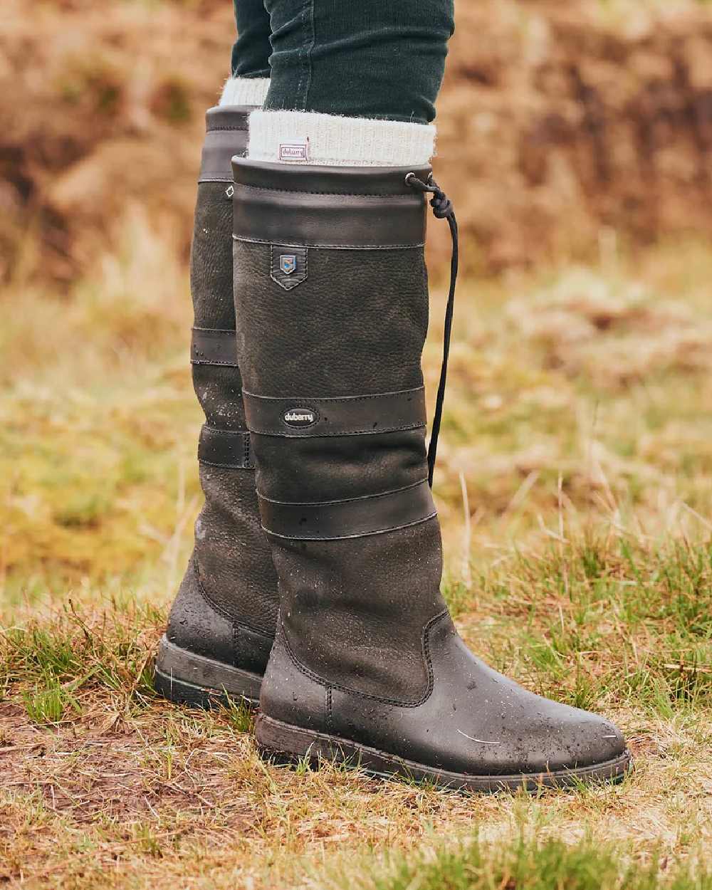 Black coloured Dubarry Galway Country Boots on grass background 