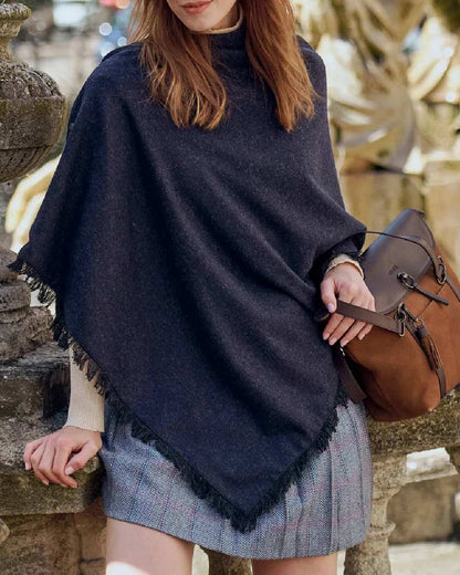 Navy Coloured Dubarry Hazelwood Tweed Poncho on wall background 