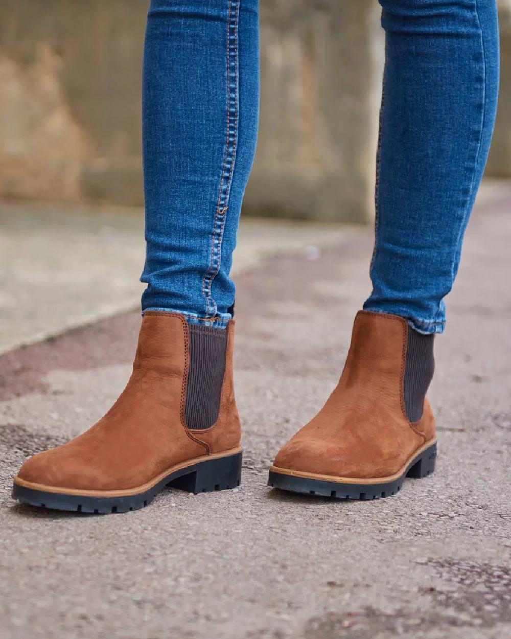 Walnut coloured Dubarry Kilcommon Chelsea Boots on road background 